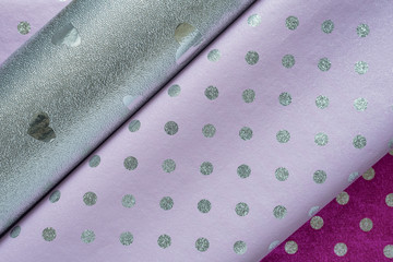 Several types of wrapping paper. Lilac polka dot silver