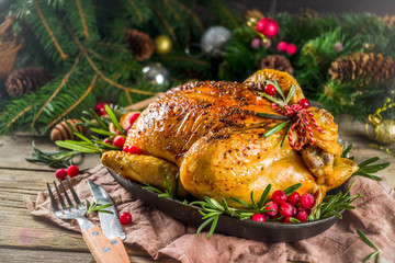 Fototapeta na wymiar Roasted whole chicken with Christmas decoration