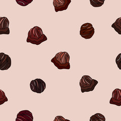 Seamless sweet pattern on pink background. Chocolate candies with glaze.