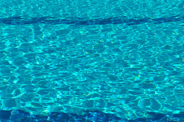 Abstract blurred background of pool water texture. Bright trendy color of water Aqua Menthe . Horizontal, free space. Design concept.