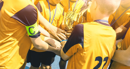 Happy Sports Team. Kids In Elementary School Sports Team Raising Golden Trophy. Children Youth...