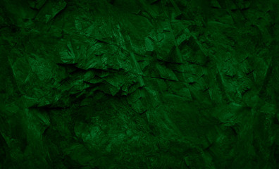 Green abstract grunge background. Dark green stone background. Toned stone texture. Moss and mold on the stones.