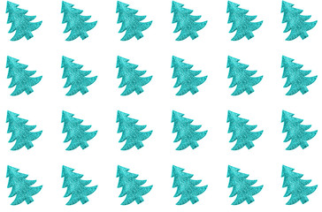 Pattern made of blue green decorative Christmas trees. Holiday concept.