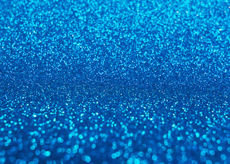 Blurred shining closeup of blue bright art texture. Macro design of classic glittering backdrop, soft selective focus. Color concept.
