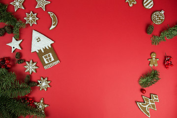 Christmas gingerbread cookies with new year decorations on red background. Holidays, christmas, dessert, new year food, design elements conceptconcept