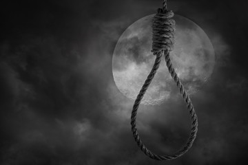 Rope noose for hanging with scary full moon and clouds bright and dark at midnight
