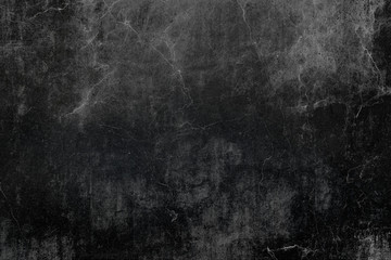 Detail of old dark cracked wall surface