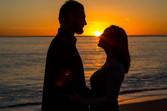 silhouette of a couple  at Sunset in Malibu, Los Angeles