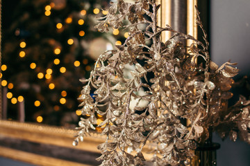 golden christmas tree decoration on wooden background