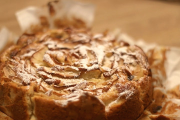 Homemade apple and mascarpone sponge cake, decorated with baked apple slices. Selective focus.