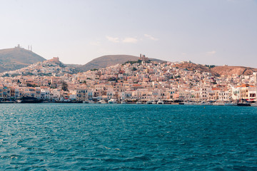 SYROS, GREECE - JUNE 26, 2019: casual from city port side streets and building at summer time