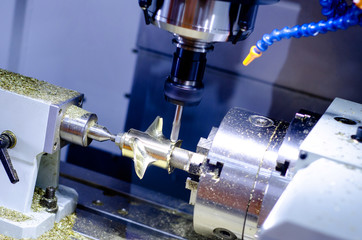 The CNC milling machine in metal working process.