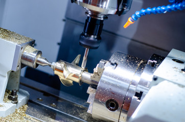 The CNC milling machine in metal working process.