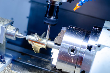 The CNC milling machine in metal working process.