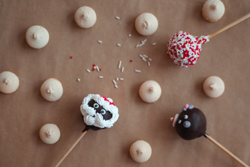 Christmassy cake POPs and little cookies  on crafting background