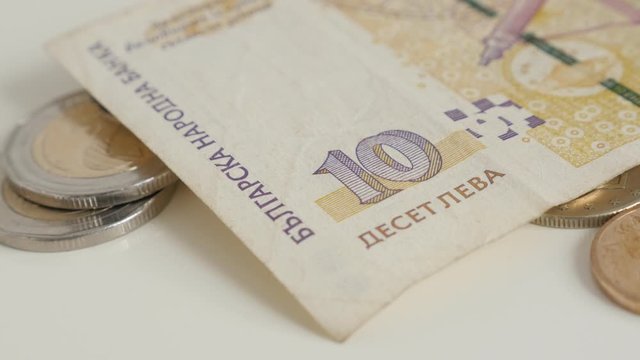 Slow pan on coins and paper money of Bulgari 4K footage