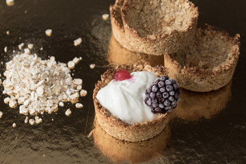 Homemade recipe made with oat flakes and natural yogurt filling, berries. Delicious and healthy breakfast snack preparation