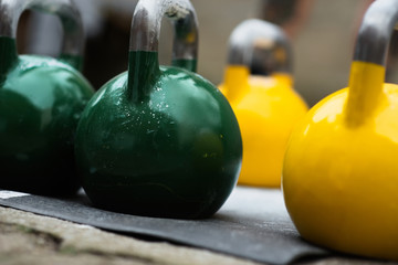 used kettlebell outside on the floor ready for strength and conditioning workout and training