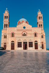 Syros, Greece view on the local church at summer sunset light