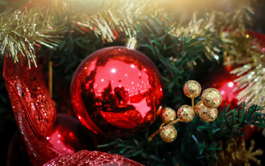 Blurry of Christmas and New Year's balls with beautiful decorations on the Christmas tree, soft light, beautiful background images and illustrations.