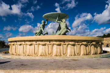 The famous Triton fountain, three bronze Tritons holding up a huge basin, in front of the City Gate...