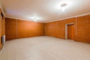 Russia, Omsk- August 02, 2019: interior room empty basement with brick walls