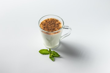 kefir in a glass, fermented drink, sour milk, with cinnamon
