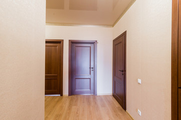 Russia, Omsk- August 02, 2019: interior room apartment. standard repair decoration in hostel. corridor, hallway, doors