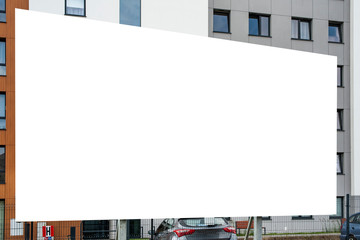 Blank white billboard mockup in the front of modern residential building.