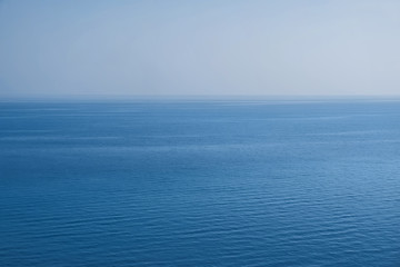 Calm open sea landscape. Nature backaround in trendy blue color.