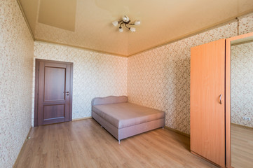 Russia, Omsk- August 02, 2019: interior room apartment. standard repair decoration in hostel. bedroom with bed