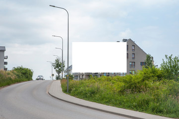 Blank white advertising billboard on the residential area