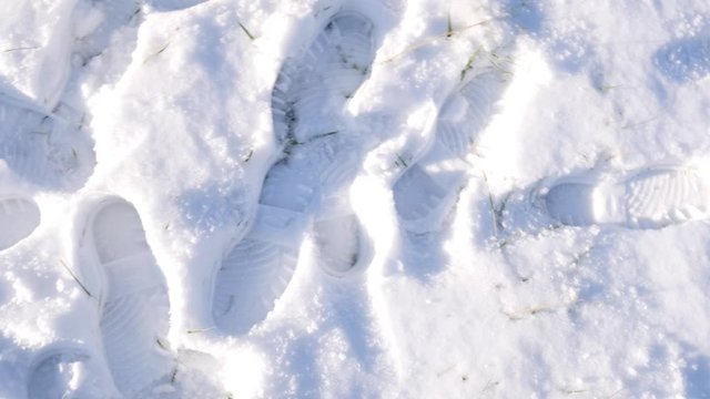 Footprints on snow cover. Winter season.