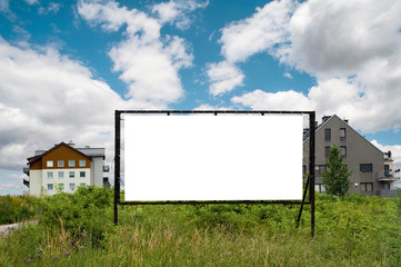 Blank white advertising billboard on the residential area
