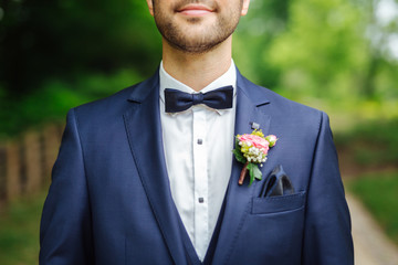 groom wearing a bow tie
