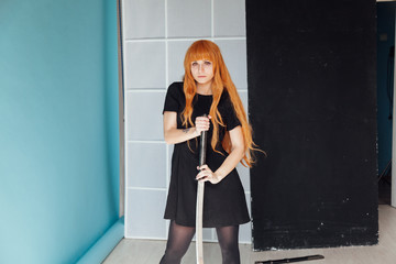 beautiful woman anime cosplayer with red hair with Japanese sword