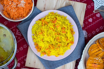 Indian basmati colorful rice with vegetables with turmeric powder.  Vegan, vegetarian food.