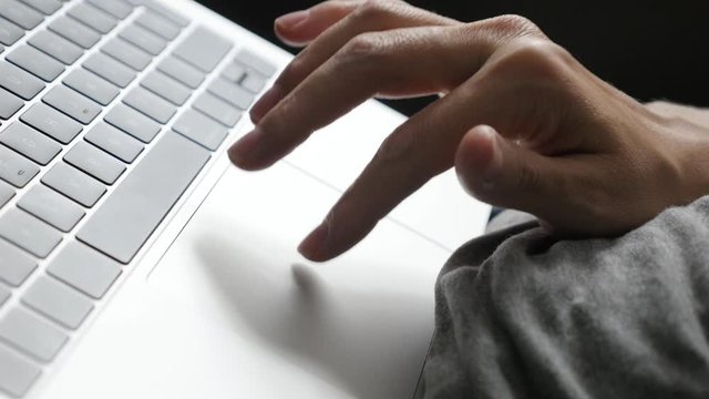 Close-up of using laptop computer while relaxing at home 4K footage