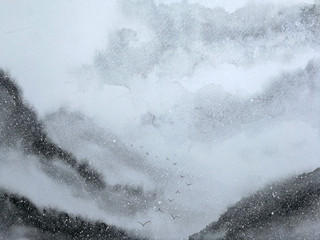 watercolor landscape painting asian art.birds  flying  mountains covered snow fall with fog in winter season.	
