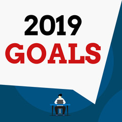 Writing note showing 2019 Goals. Business concept for something that you are trying to do or achieve for this year Man sitting chair desk working laptop geometric background