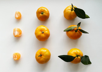 tangerines with leaves on white background