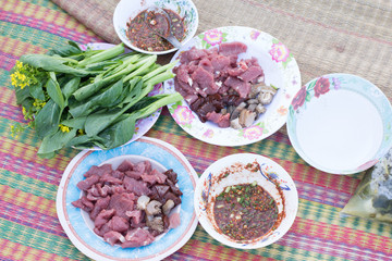 Raw meat with onions on a plate