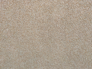Plain beige brown wall building with visible texture pattern of an outside or inside building wall for cool blank wallpaper or background