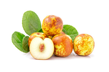 Jujubes fruit with green leaf isolated on a white background. Closeup