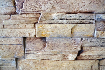 beige natural stone wall texture closeup