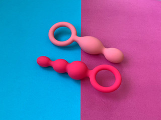 Two anal plugs. Bright background. Useful for sex shop