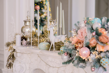 Christmas decorations on a large white fireplace