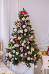 Christmas tree in a white cozy room