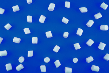 Classic Blue paper background with marshmallow. Cozy sweet background.