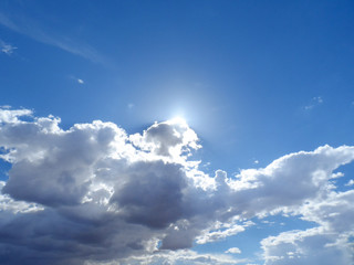 Sun peaks out frombehind the clouds